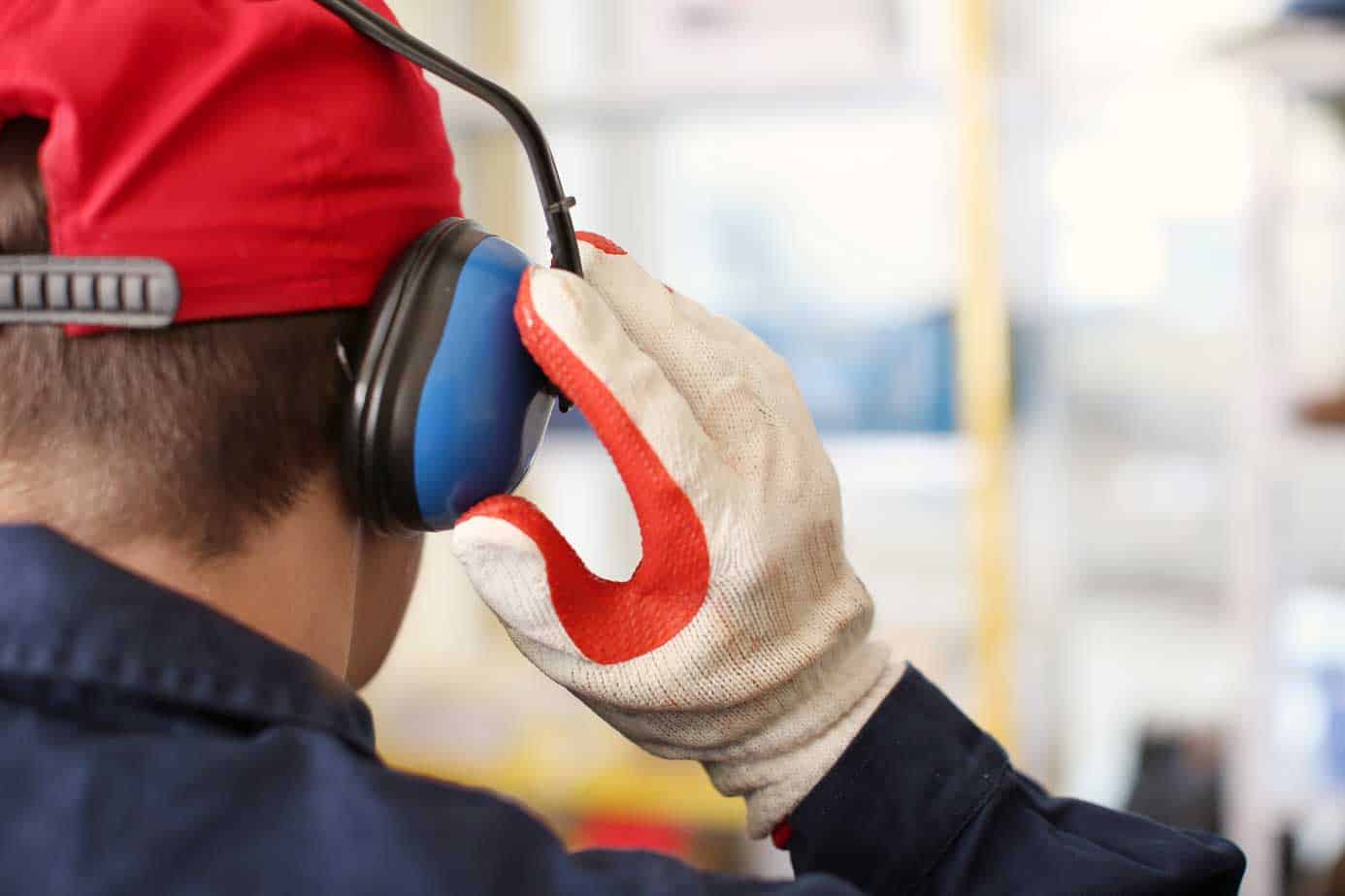 worker using hearing safe headphones